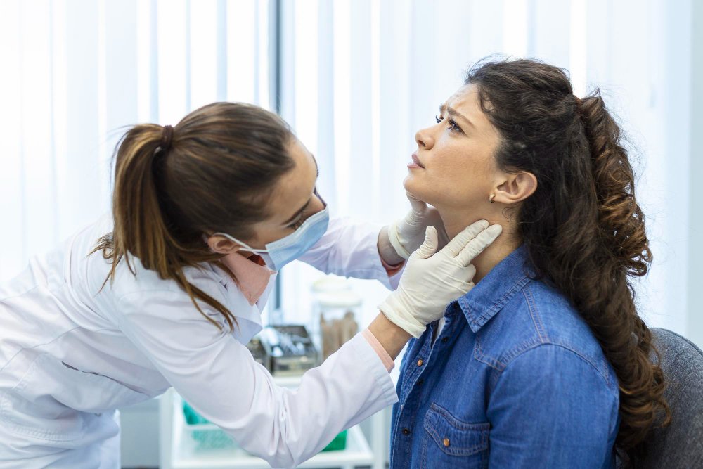 “Photo of a healthcare provider interacting with a patient during a medical appointment in a clinical setting. Image used by a medical clinic in San Bernardino to represent patient care and primary healthcare services