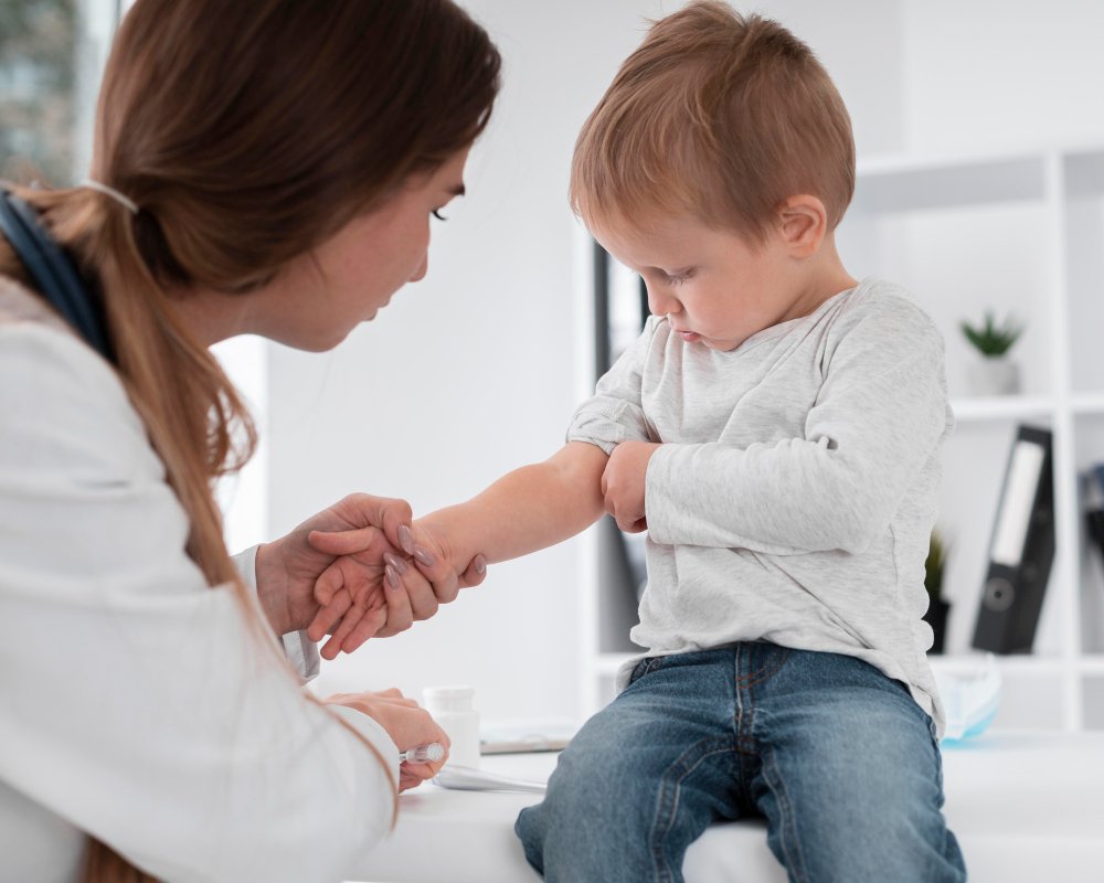 Photo of a healthcare provider examining a child during a routine checkup in a clinical setting. Image used by a medical clinic in San Bernardino to represent pediatric care and preventive health services