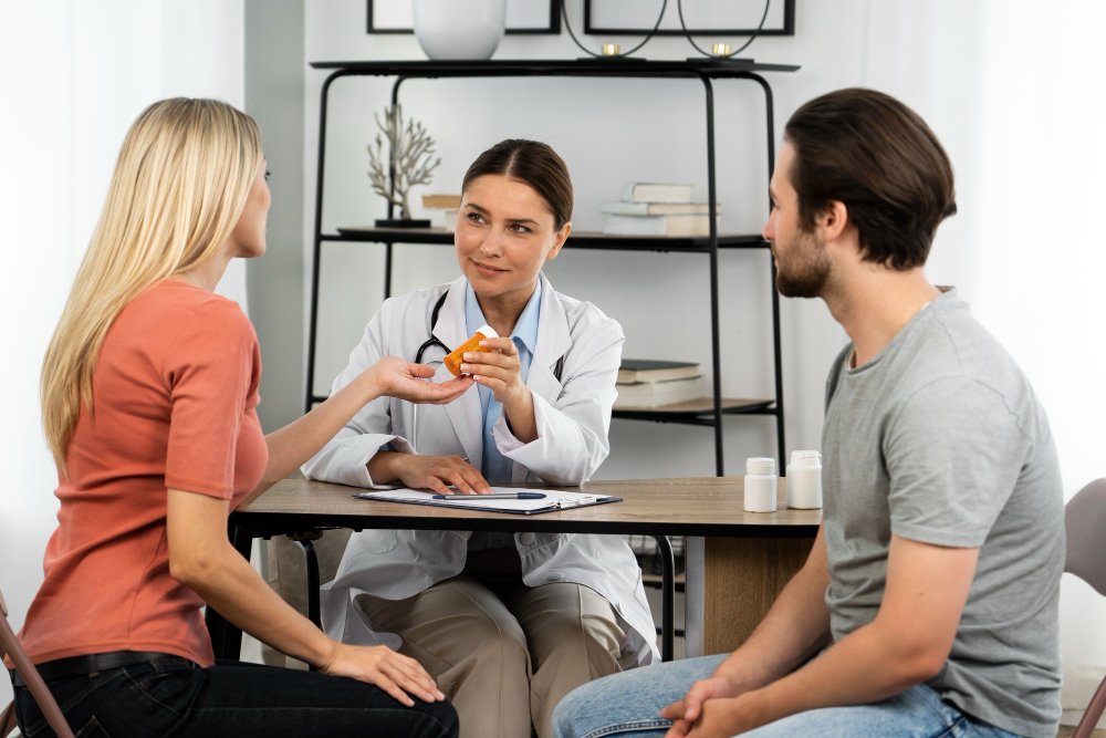 Photo of a couple meeting with a healthcare provider during a routine medical check up. Image used by a medical clinic in San Bernardino to represent family focused primary care