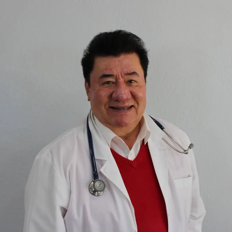 A man in a white coat.